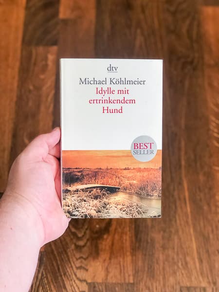 Cover von Idylle mit ertrinkendem Hund